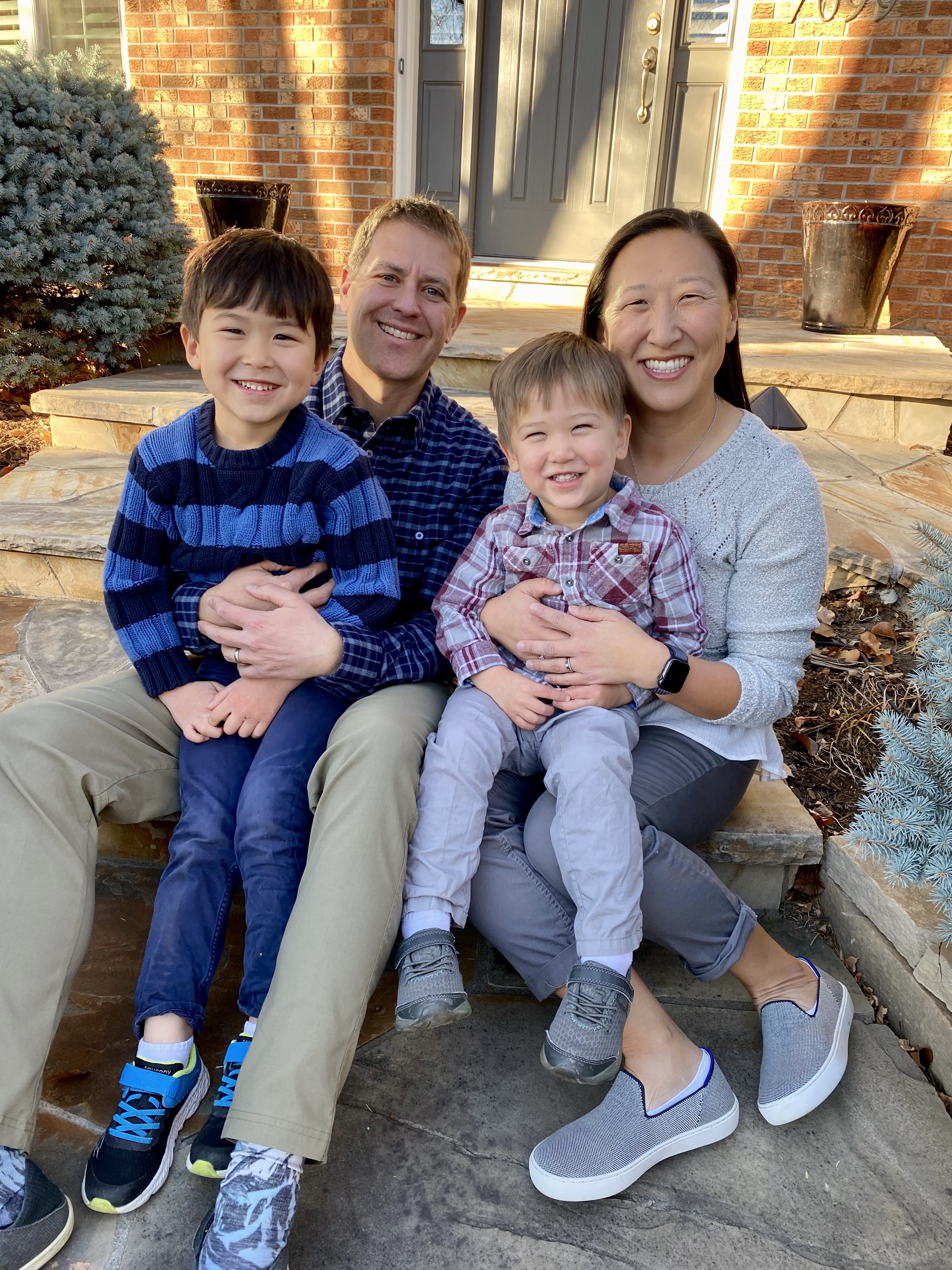Tim Cook and family on front porch steps.